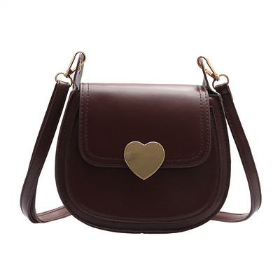 Κομψή γυναικεία τσάντα από οικολογικό δέρμα με μεταλλικό κουμπιά και μεγάλη λαβή