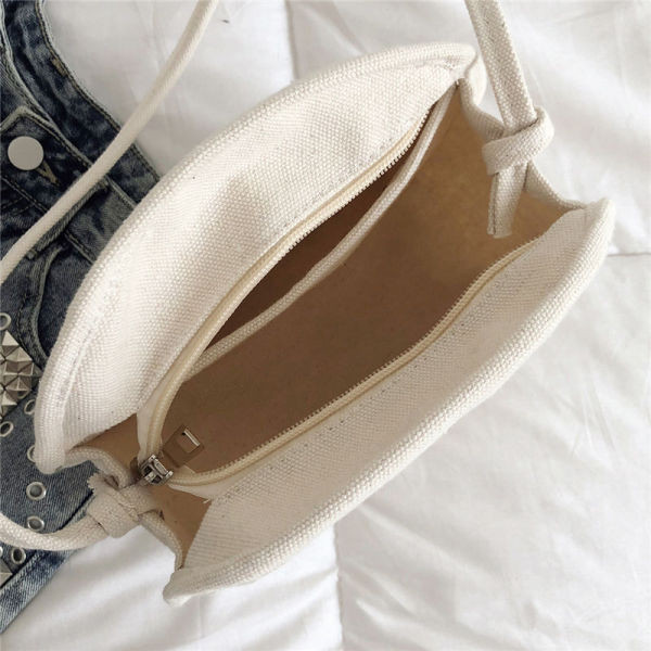 Ikdienas sieviešu trikotāžas soma ar garu rokturi apaļā formā