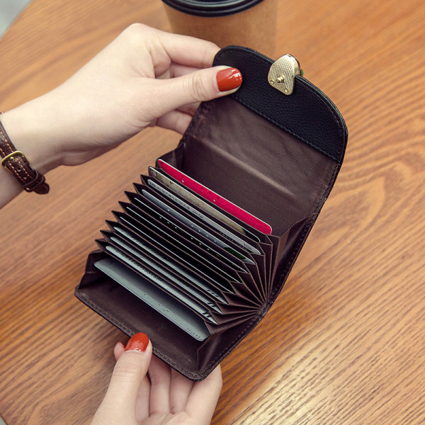 Μοντέρνο μικρό γυναικείο πορτοφόλι από οικολογικό δέρμα με μεταλλική στερέωση