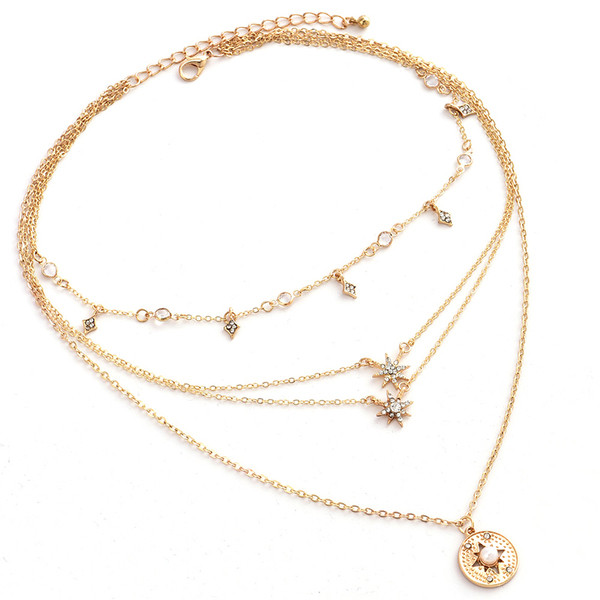 Nježna ženska ogrlica na četiri razine sa mnogo elemenata