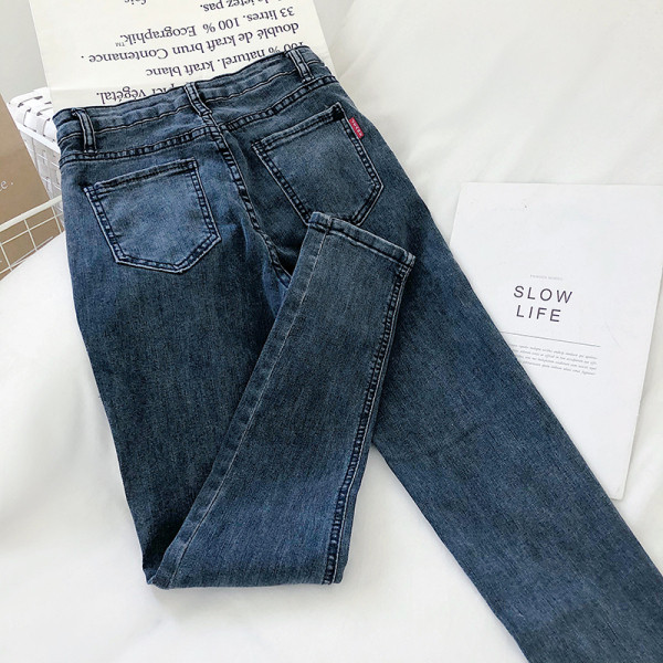 Pieguļoši sieviešu džinsi ar augstu vidukli un kabatu