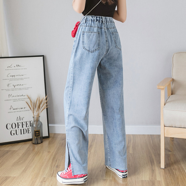 Mūsdienīgi sieviešu džinsi ar augstu vidukli un šķēlumu - plats modelis