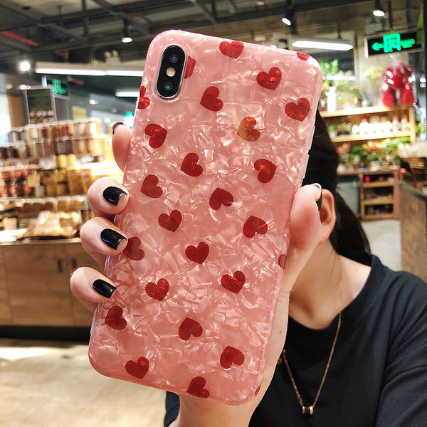 IPhone XS maciņš ar spīdīgu efektu un sarkanām sirsniņām