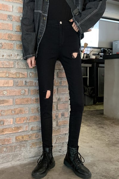 Modern női hosszú farmer szakadt motívummal, magas derékkal