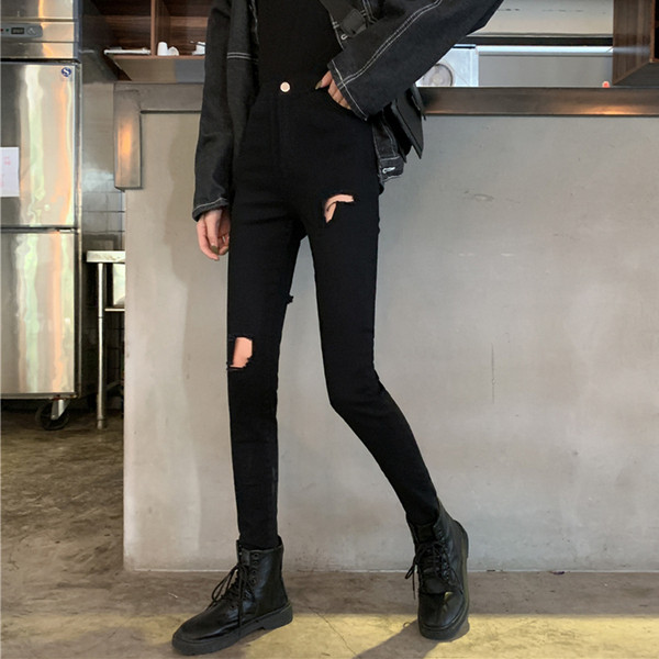 Modern női hosszú farmer szakadt motívummal, magas derékkal