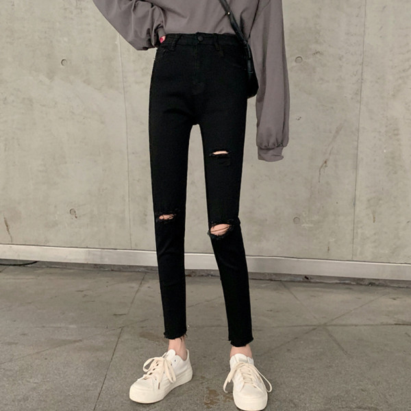 Modern női hosszú farmer szakadt motívummal, magas derékkal