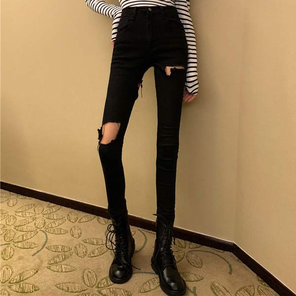 Modern női hosszú farmer szakadt motívummal, magas derékkal