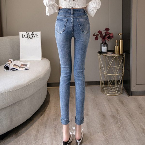 Női farmer magas derékkal Karcsú modell szakadt motívumokkal