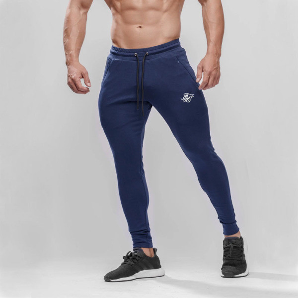 Sporta un ikdienas vīriešu bikses Slaids modelis ar elastīgu jostasvietu un izšuvumu