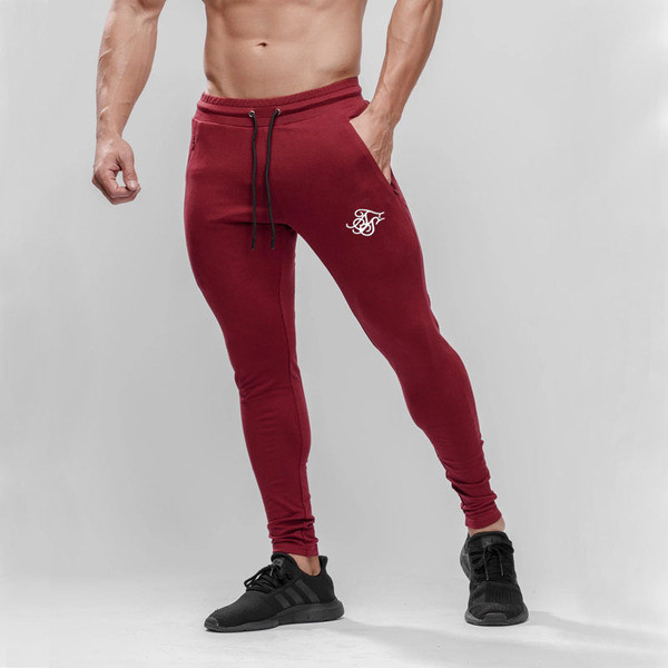 Sporta un ikdienas vīriešu bikses Slaids modelis ar elastīgu jostasvietu un izšuvumu