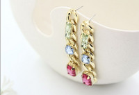 Eleganti sieviešu karājoši zelta auskari ar akmeņiem