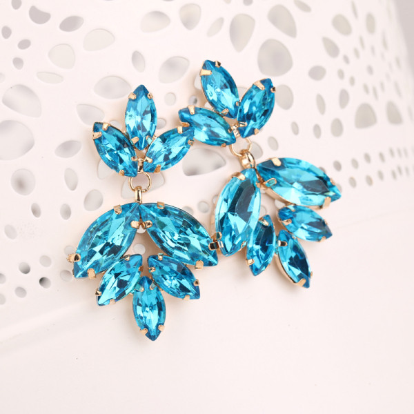 Eleganti sieviešu auskari ar zilu akmeni