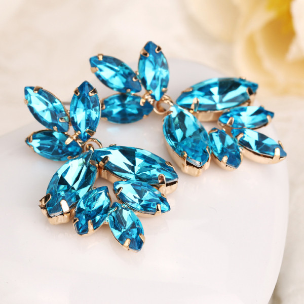 Eleganti sieviešu auskari ar zilu akmeni