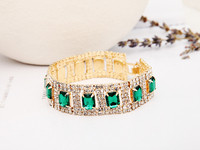 Elegáns női karkötő zöld és lila kövekkel