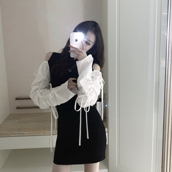 Sieviešu īsā kleita ar atkailinātiem pleciem un saitēm