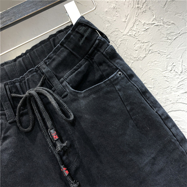 Naiste vabaaja pikad teksad paelte ja taskutega