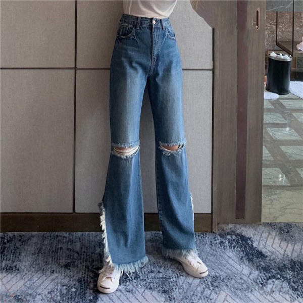 Platūs moteriški džinsai aukštu liemeniu ir plėšytais motyvais