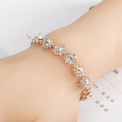 Stylish women`s silver and gold bracelet with stones