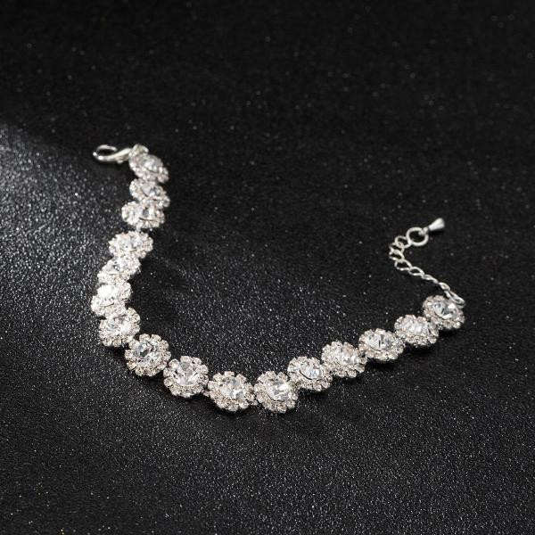 Elegantna ženska srebrna i zlatna narukvica s kamenčićima