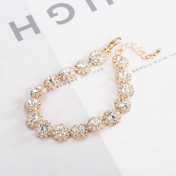 Elegantna ženska srebrna i zlatna narukvica s kamenčićima