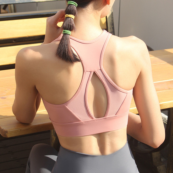 Sieviešu sporta krūšturis ar izgrieztu muguras daļu, polsteriem un rāvējslēdzēju
