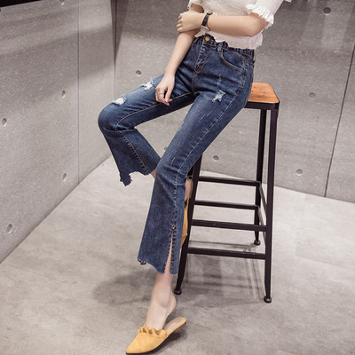 Aktuāli sieviešu džinsi ar kabatām un saplēstiem motīviem