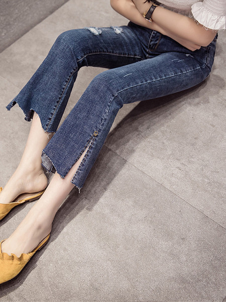 Aktuāli sieviešu džinsi ar kabatām un saplēstiem motīviem