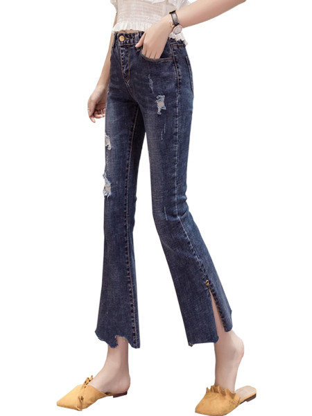 Aktuāli sieviešu džinsi ar kabatām un saplēstiem motīviem