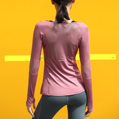 Women`s sports blouse made of quick-drying and breathable fabric with long sleeves
