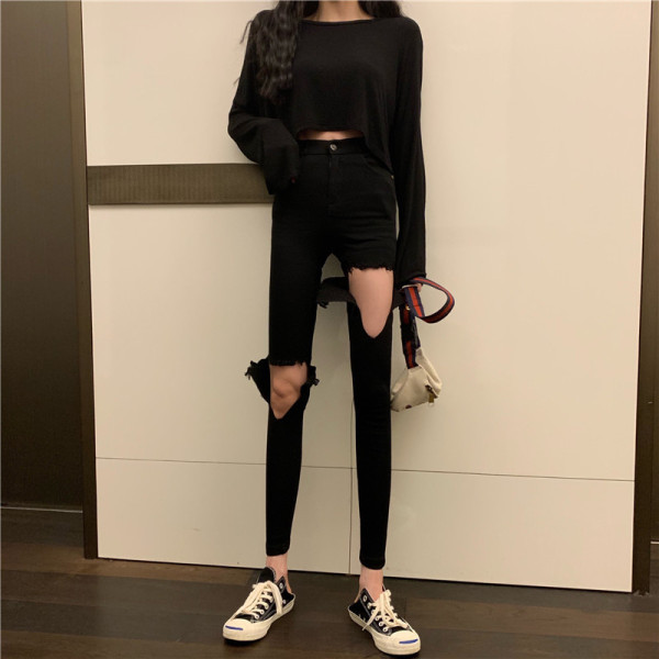 Polsterējums moderni džinsi Slim modelis ar saplēstiem motīviem