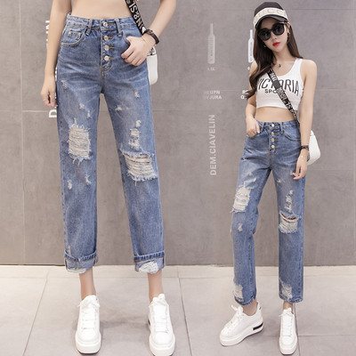 Moteriški aktualūs džinsai su plėšytais motyvais tiesus modelis