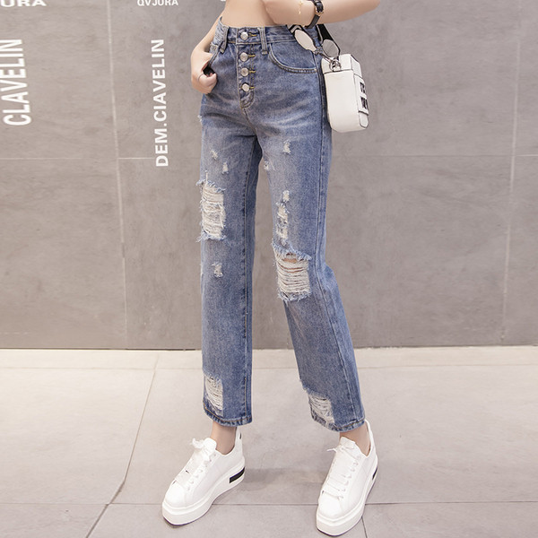 Moteriški aktualūs džinsai su plėšytais motyvais tiesus modelis