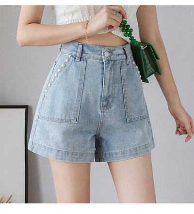 Mūsdienīgi sieviešu šorti ar augstu vidukli un dekoratīvām pērlēm