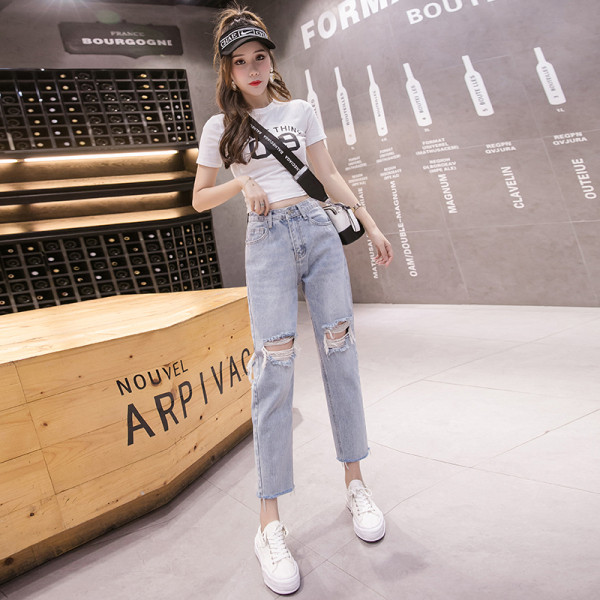 Sieviešu džinsi ar augstu vidukli un saplēstu motīvu zilā krāsā