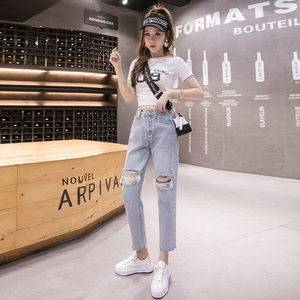 Sieviešu džinsi ar augstu vidukli un saplēstu motīvu zilā krāsā