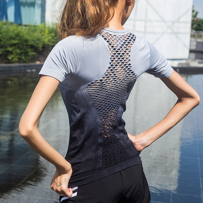 Women`s sports t-shirt made of breathable fabric in iridescent colors