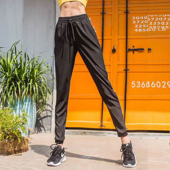 Черен спортен панталон с висока еластична талия и мрежа