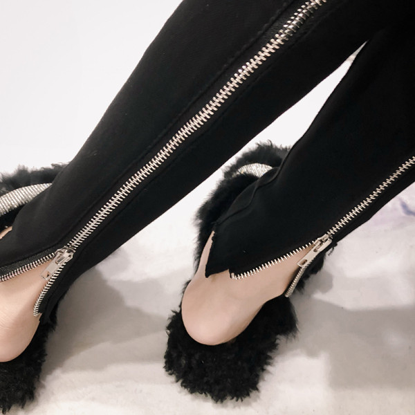 Testhezálló fekete női nadrág magas derékkal és cipzárral