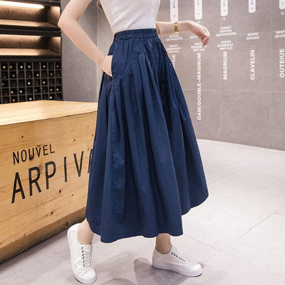 Széles női nadrág magas derékkal és zsebekkel