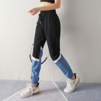 Спортен дамски панталон от бързосъхнеща материя с висока еластична талия