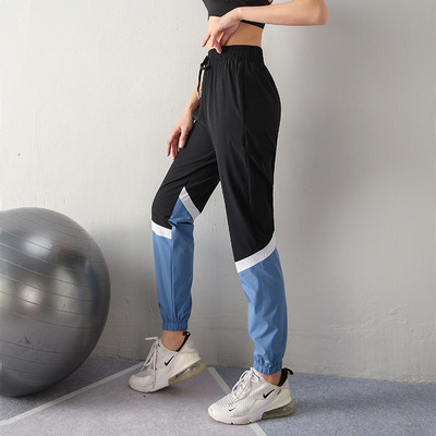 Sieviešu sporta bikses no ātri žūstoša auduma ar augstu elastīgu jostasvietu