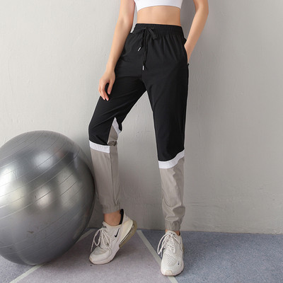 Sieviešu sporta bikses no ātri žūstoša auduma ar augstu elastīgu jostasvietu