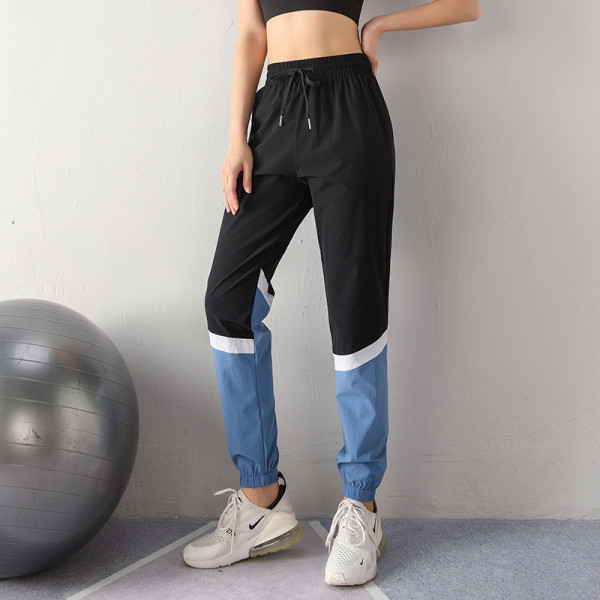 Sieviešu sporta bikses no ātri žūstoša auduma ar augstu elastīgu jostasvietu