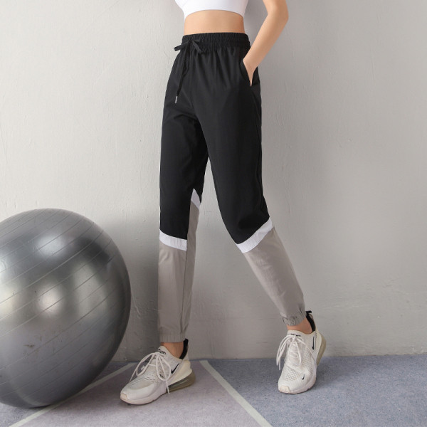 Sieviešu sporta bikses no ātri žūstoša auduma ar augstu elastīgu jostasvietu