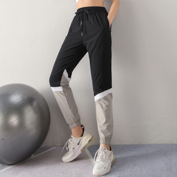 Sieviešu sporta bikses no ātri žūstoša auduma ar augstu elastīgu jostasvietu