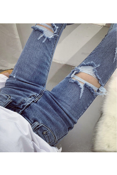 Novi model dugih ženskih traperica sa poderanim motivima