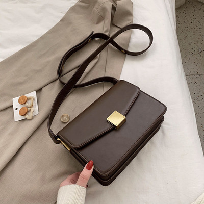 Kasdieninis moteriškas krepšys su metaliniu užsegimu ir ilga rankena