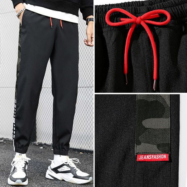 Férfi sportnadrág zsebekkel és szegéllyel