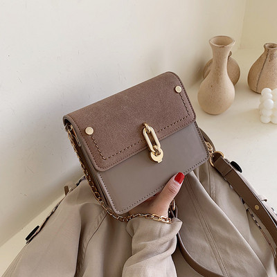 Modern női táska eko bőrből, hosszú fém fogantyúval