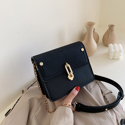 Modern női táska eko bőrből, hosszú fém fogantyúval